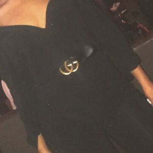 Black Gucci belt with leather strap. Gold buckle